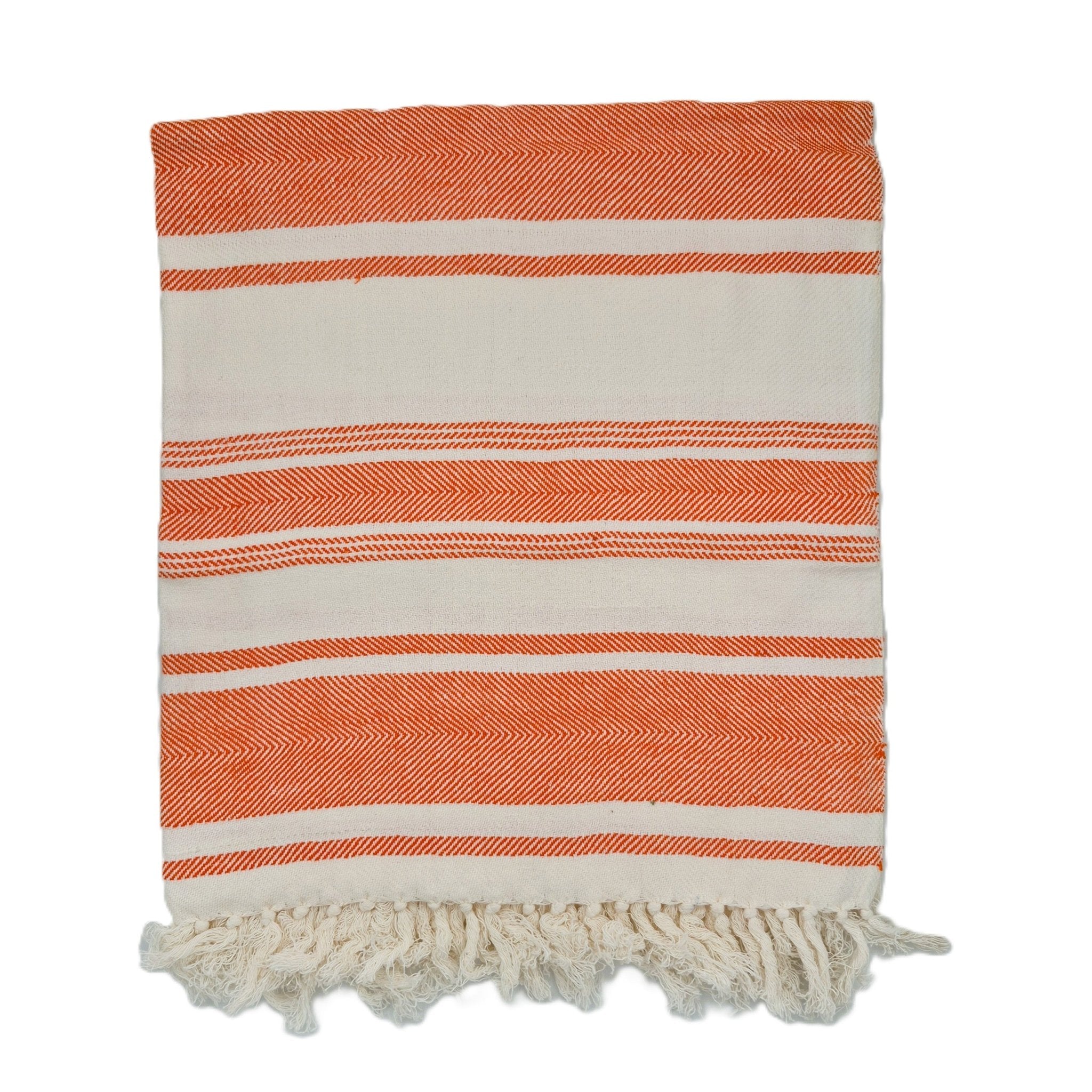 Striped orange and white towel with fringe on a white background