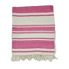 Pink and white striped towel with fringe on a white background