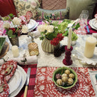 Festive Red block print tablecloth in cotton, deep red with white flowers and foliage, laid for a Christmas table setting
