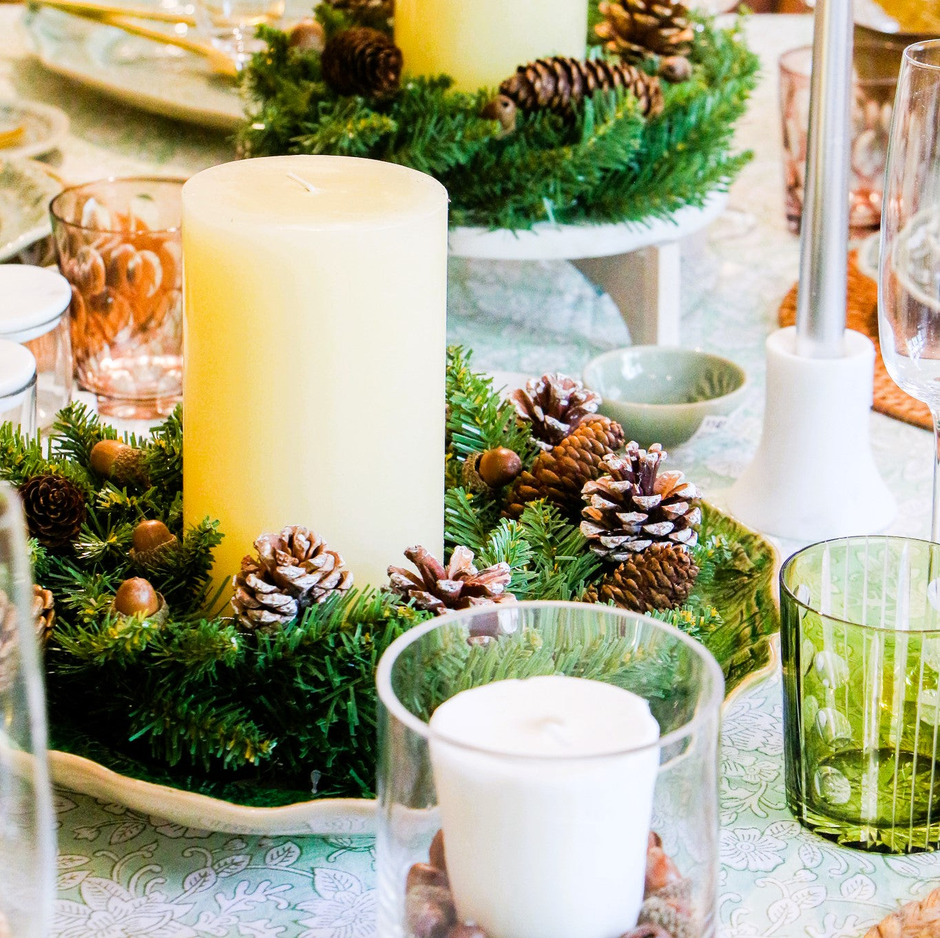 Ivory pillar candle, 10 cm diameter, shown with hurricane lamp, styled