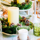 Ivory pillar candle, 10 cm diameter, shown with hurricane lamp, styled