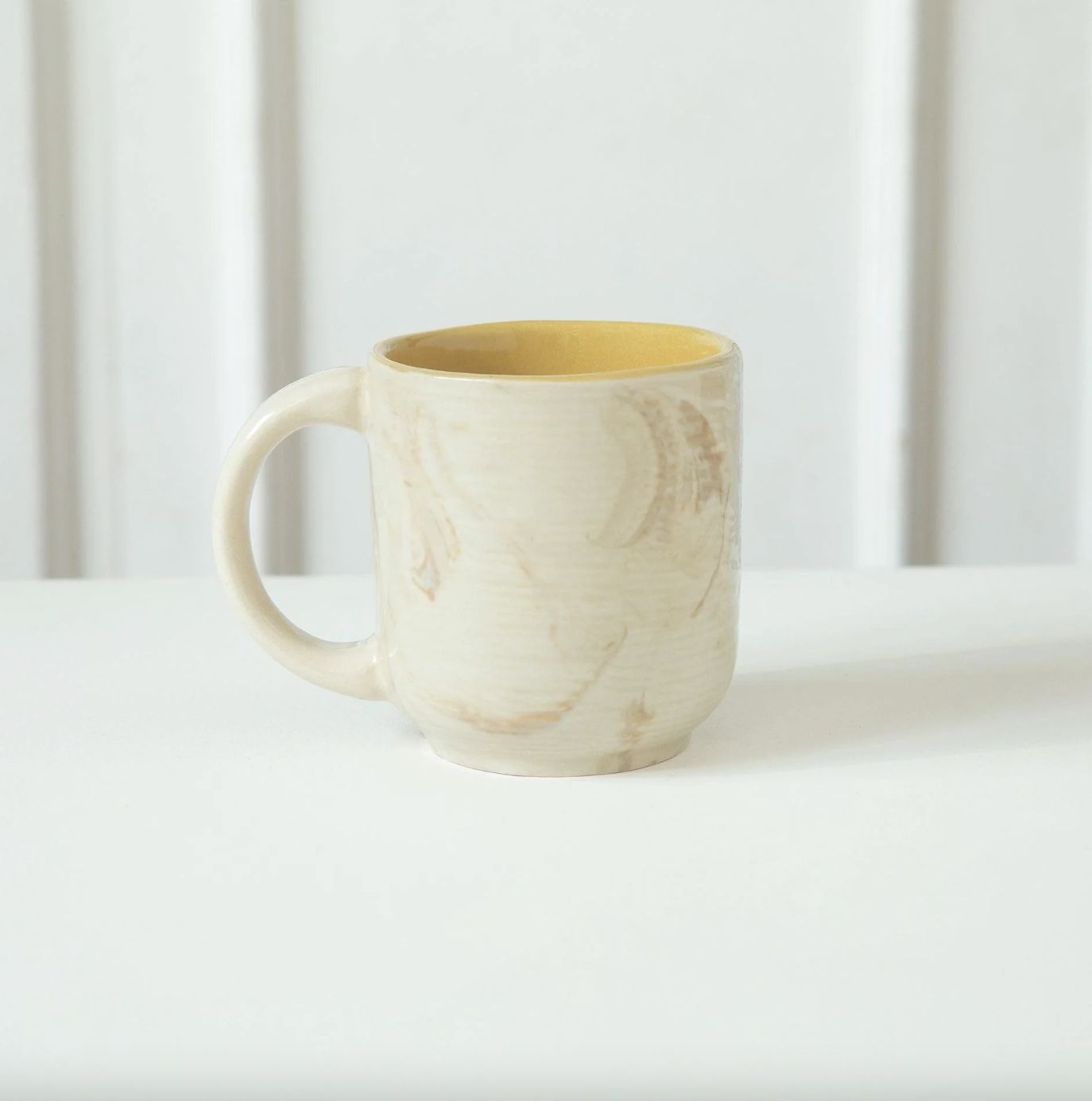 Handmade Amber Love ceramic mug with beige exterior and mustard interior, 200 ml