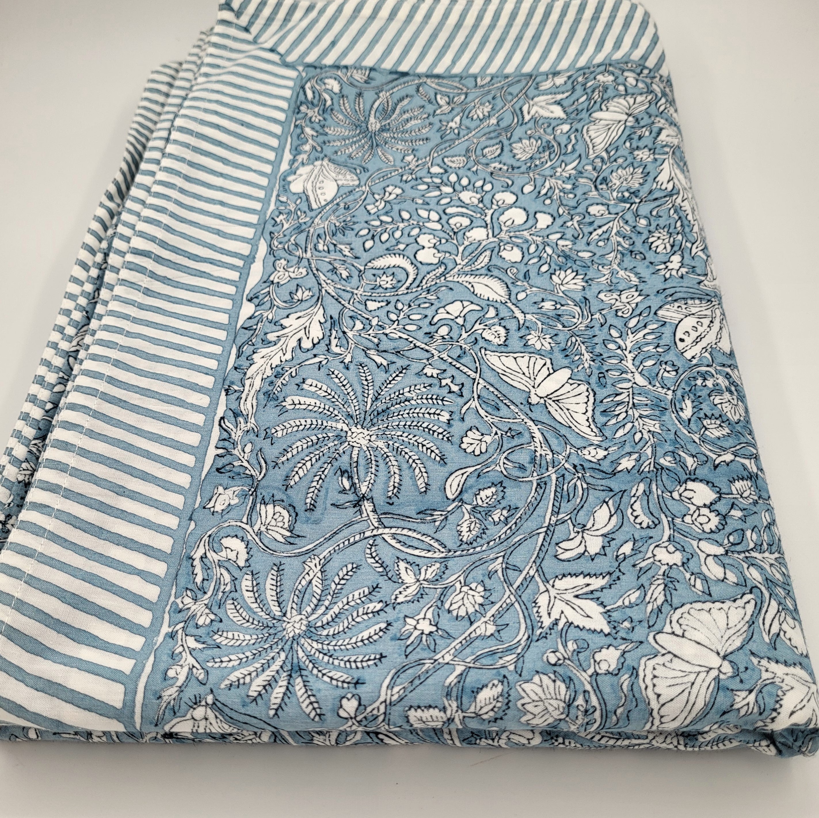 Sky blue rainforest block-print cotton tablecloth with a striped border