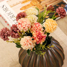 Bronze Salon round vase, ribbed terracotta, styled view
