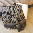 Handwoven silk and wool throw styled on a sofa, India