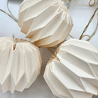 Origami paper bauble garland with LED lights, styled, detail view