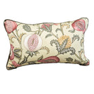 A rectangular decorative throw pillow featuring a vintage botanical pattern with pink flowers, green leaves, and a yellow seed head on a cream-colored fabric background.