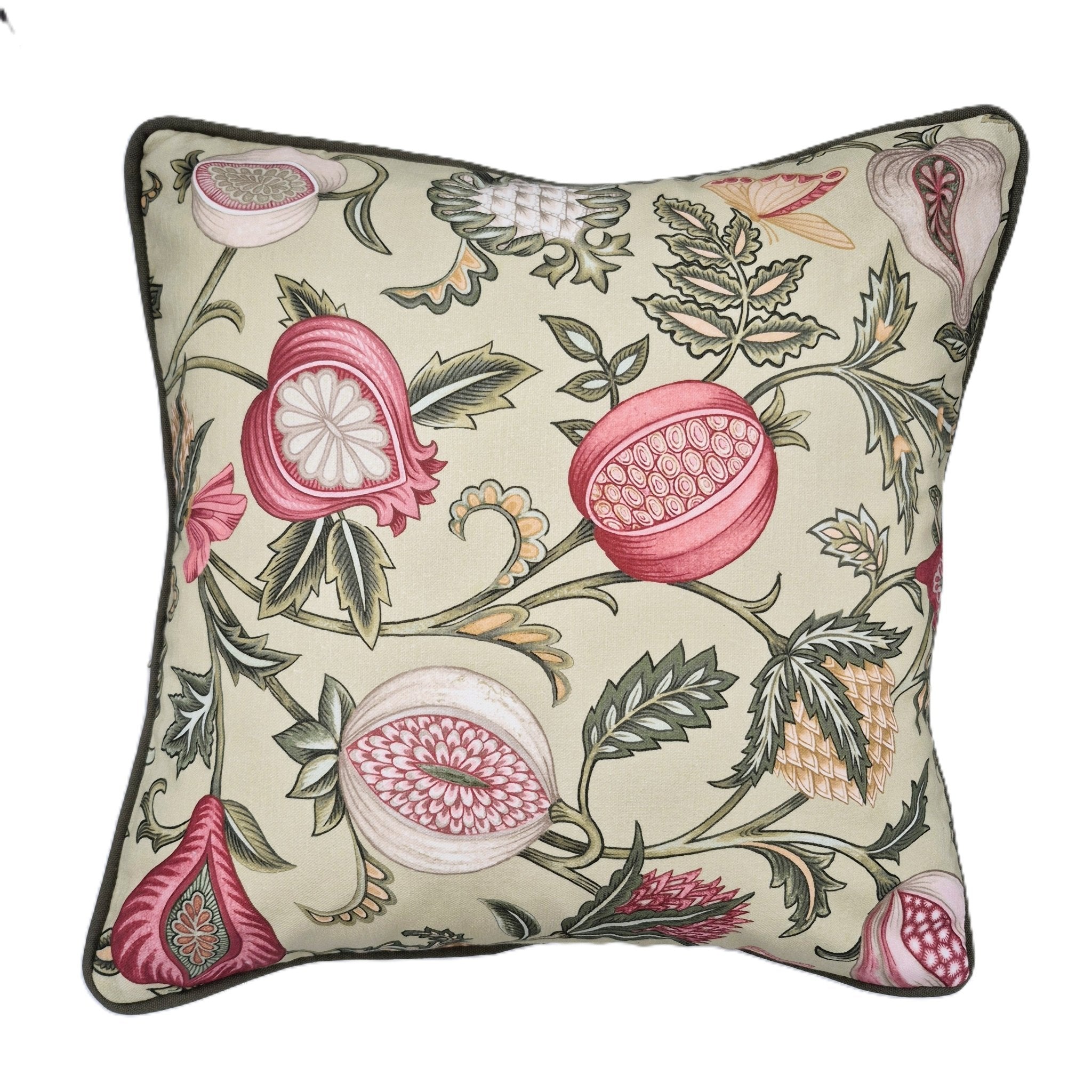 A square decorative throw pillow featuring a botanical fruit print with pink pomegranates, green leaves, and beige background, finished with a green piped edge.