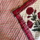 Queen block-print quilt with a red poppy pattern