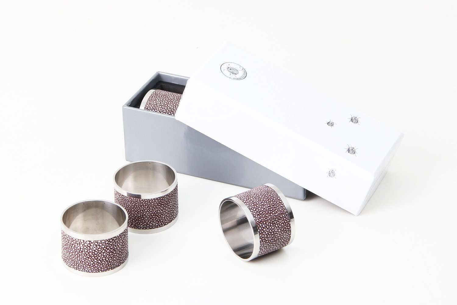 Mulberry faux shagreen napkin rings by Forwood Design, set of 4, styled on a dinner table