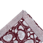 Lotus block-print tablecloth in burgundy cotton, detail of the all-over lotus print