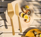 Celestial brass cake server and knife set of 2 with a matte gold finish