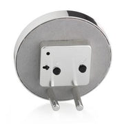 Round chiffon and silver enamel alarm clock, grey velvet backing, side view