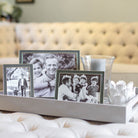 Taupe enamel frame by Addison Ross, styled with a photo in portrait orientation