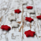 Red and white felt star garland, handwoven, India, detail