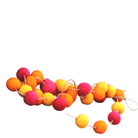 Red, orange and yellow felt pom-pom garland, handmade in India