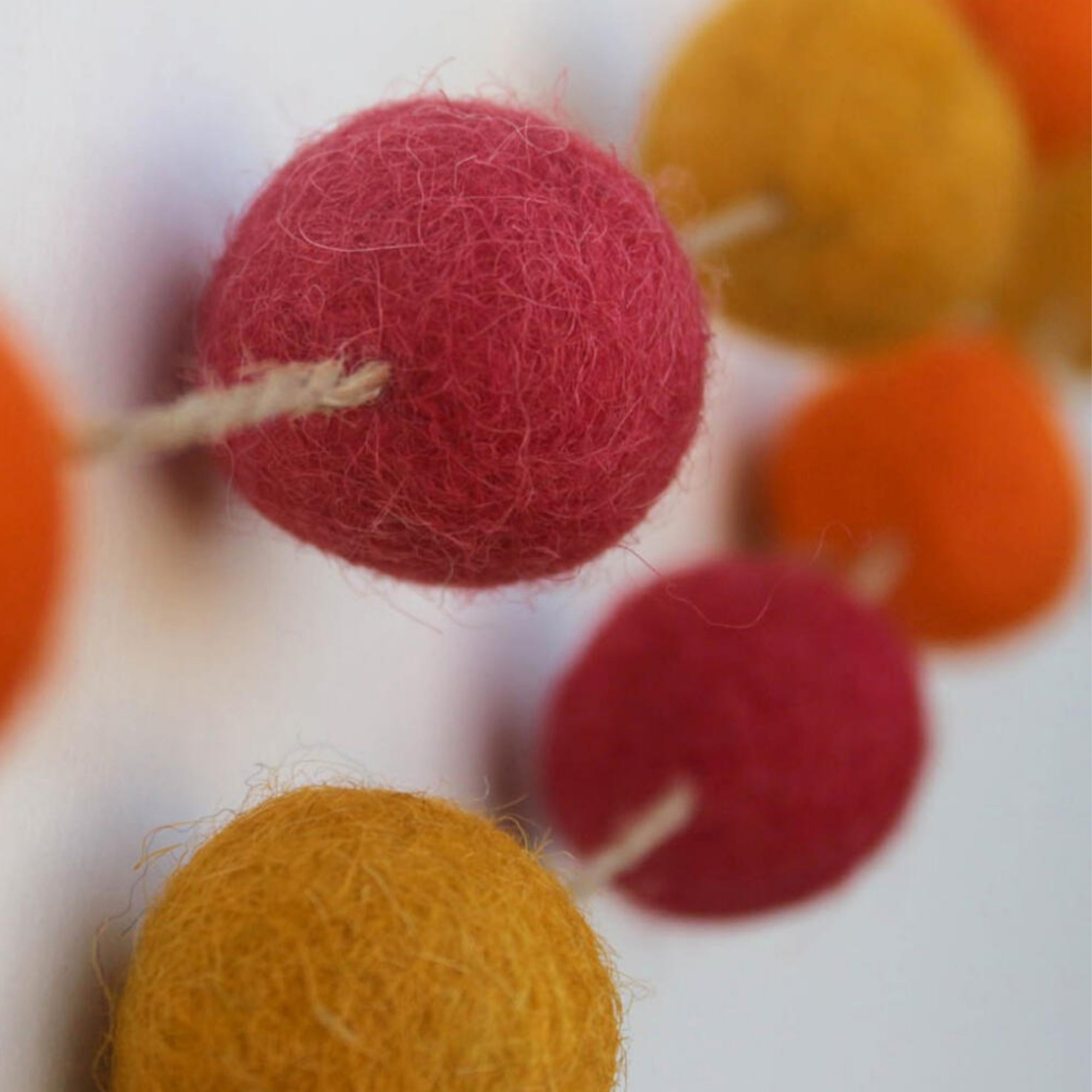 Orange felt pom-pom garland, handmade in Jaipur