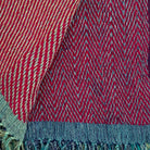 Handwoven silk and linen throw in warm red tones with bi-colour tassels, 130 x 170 cm
