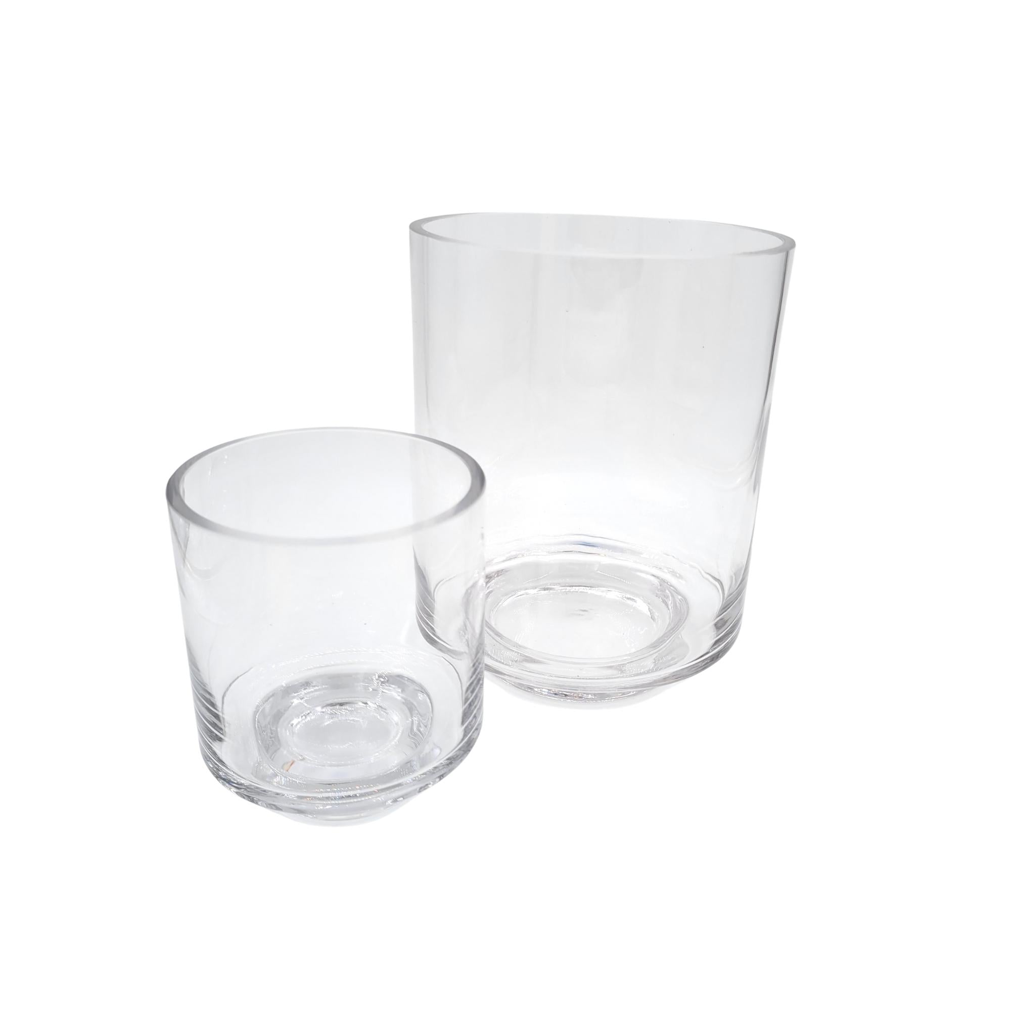 Set of two glass candle stands with pillar candles, medium and large sizes