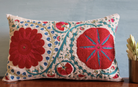 Suzani Fergana linen cushion, turquoise and pink, close view