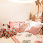Teak canopy bed with a carved head and footboard and mirror inlays