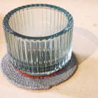 Ribbed glass tea light holders in teal, set of three